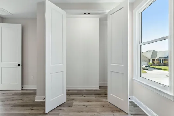 a view of entryway with wooden floor