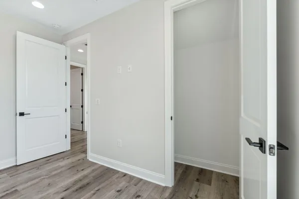 an empty room with wooden floor