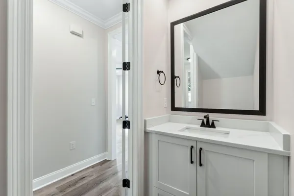 a bathroom with a sink and a mirror