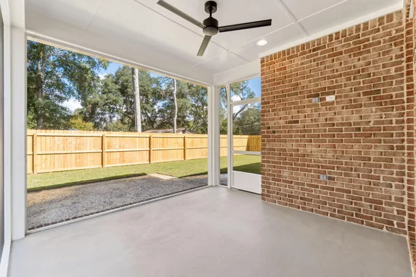 a view of an empty room and a window