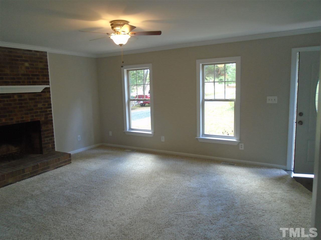 3241 Banks Road Raleigh, NC 27603 - Photo 19 of 19 a view of empty room with a fireplace