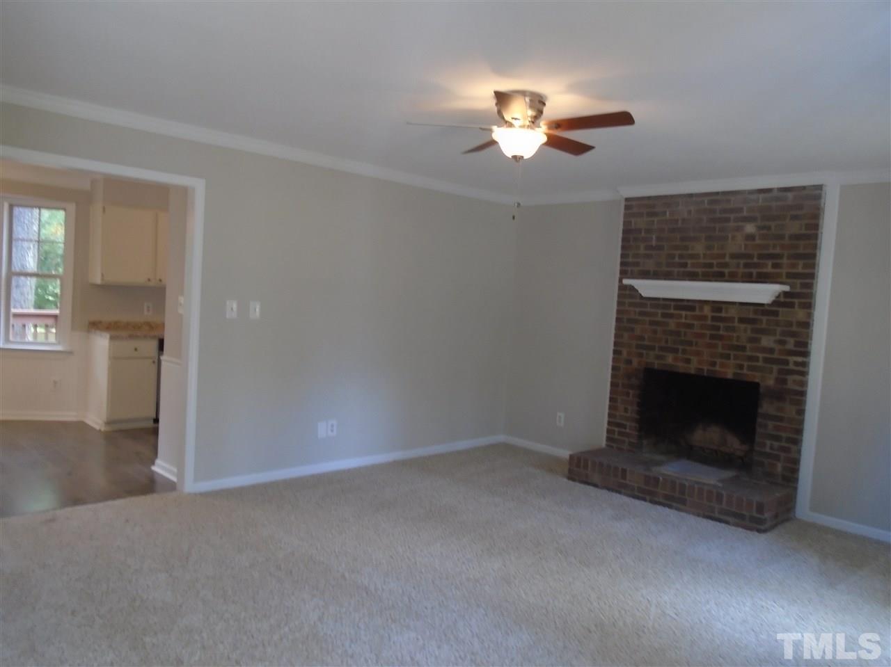 3241 Banks Road Raleigh, NC 27603 - Photo 3 of 19 a view of empty room with fireplace