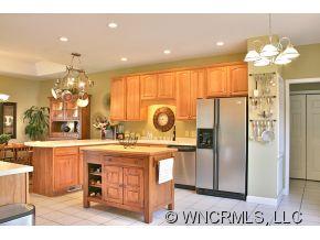448 Bob Hardin Road Rutherfordton, NC 28139 - Photo 14 of 24 a kitchen with kitchen island granite countertop a stove and a refrigerator