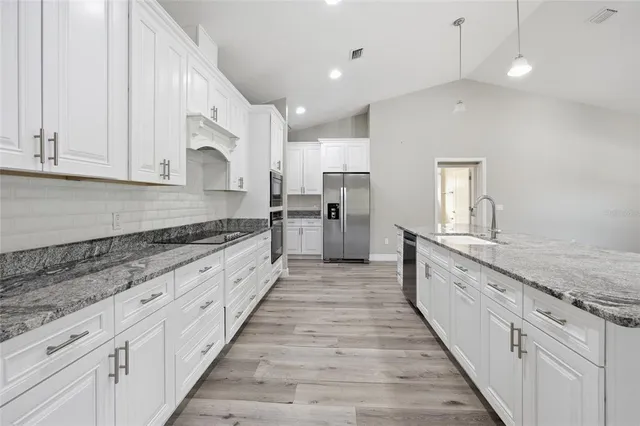 a large kitchen with cabinets