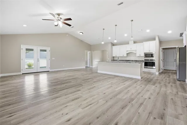 a view of kitchen with cabinets and wooden floor