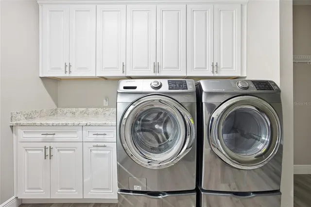 a utility room with dryer and washer