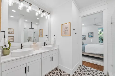 a living room with furniture and kitchen view