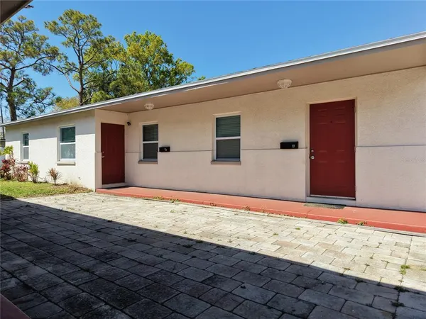 a view of garage with wooden floor and fence