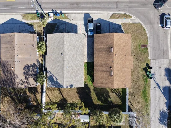 an aerial view of residential house with outdoor space and swimming pool