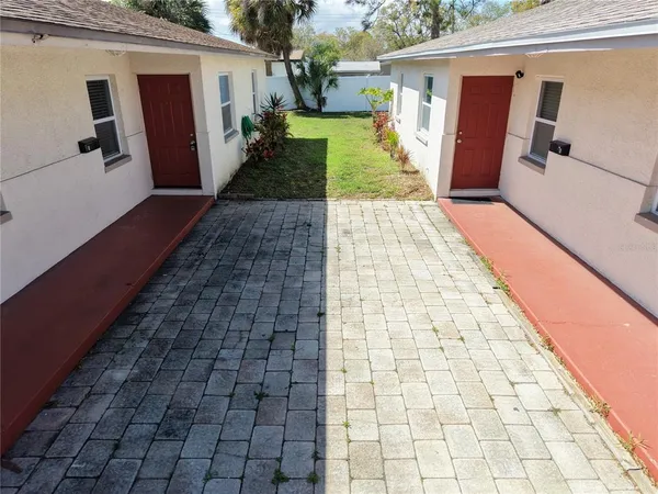 a view of a backyard of the house