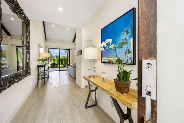 a dining room with furniture a livingroom and chandelier