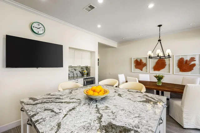 a living room with furniture and flat screen tv