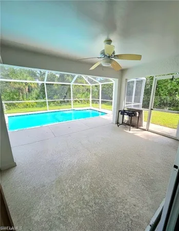 a view of a hallway view with floor to ceiling window and stairs