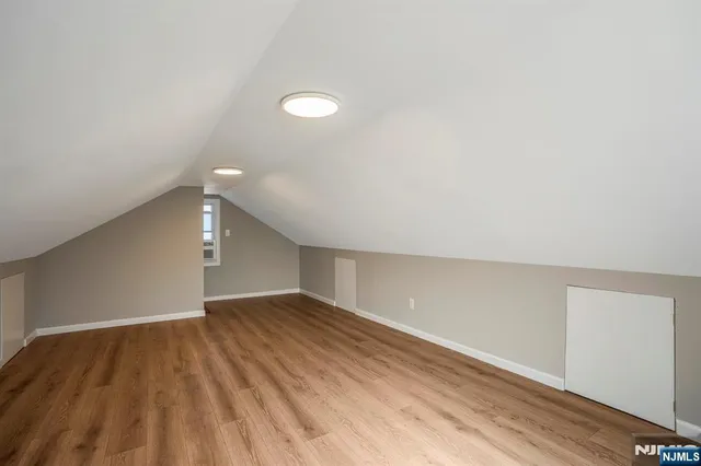 a bathroom with a shower a sink and toilet