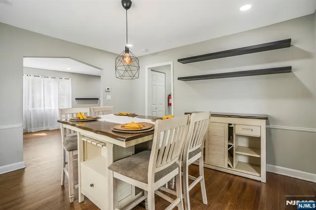 a kitchen with a stove and a chandelier