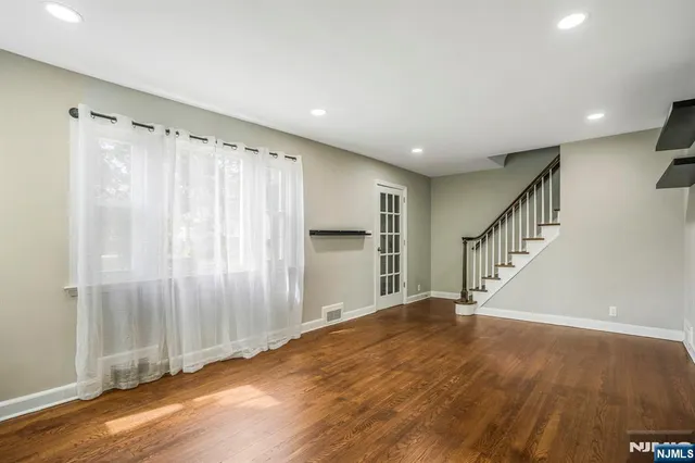 a view of entryway with wooden floor