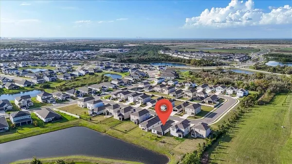 an aerial view of residential houses with outdoor space
