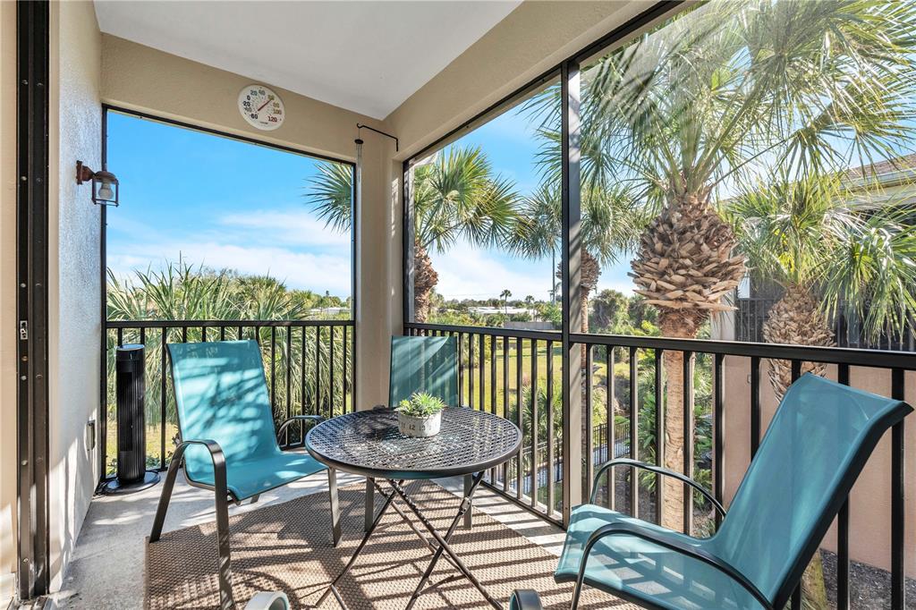 7250 Hamilton Road, Unit 7250 Bradenton, FL 34209 - Photo 13 of 34 a view of a balcony with chair and wooden floor