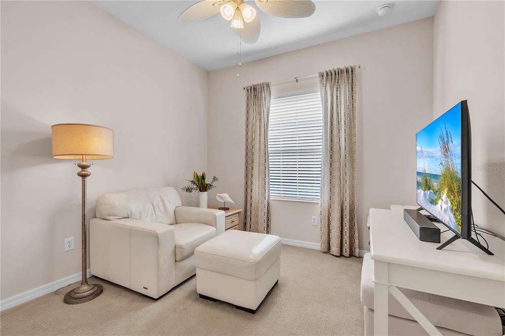 7250 Hamilton Road, Unit 7250 Bradenton, FL 34209 - Photo 25 of 34 a living room with furniture and a flat screen tv