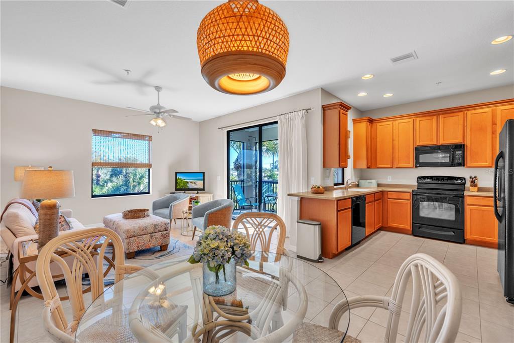 7250 Hamilton Road, Unit 7250 Bradenton, FL 34209 - Photo 9 of 34 a living room with furniture a stove and a window
