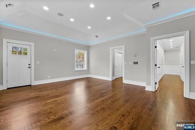 a kitchen with a sink appliances and cabinets