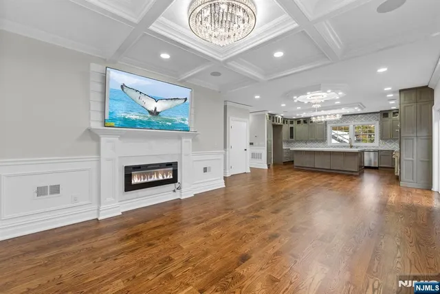 a view of livingroom with hardwood floor and a sink