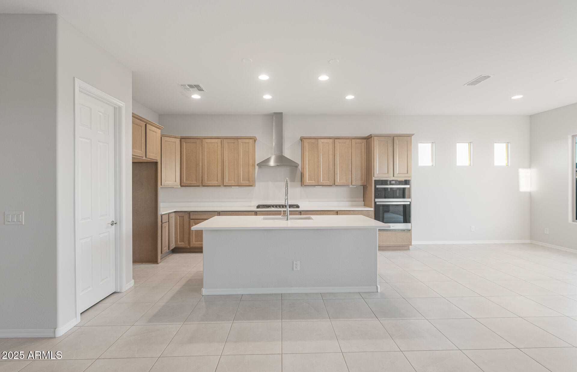 16170 West Red Bird Road Surprise, AZ 85387 - Photo 11 of 27 a view of kitchen with sink refrigerator and wooden floor