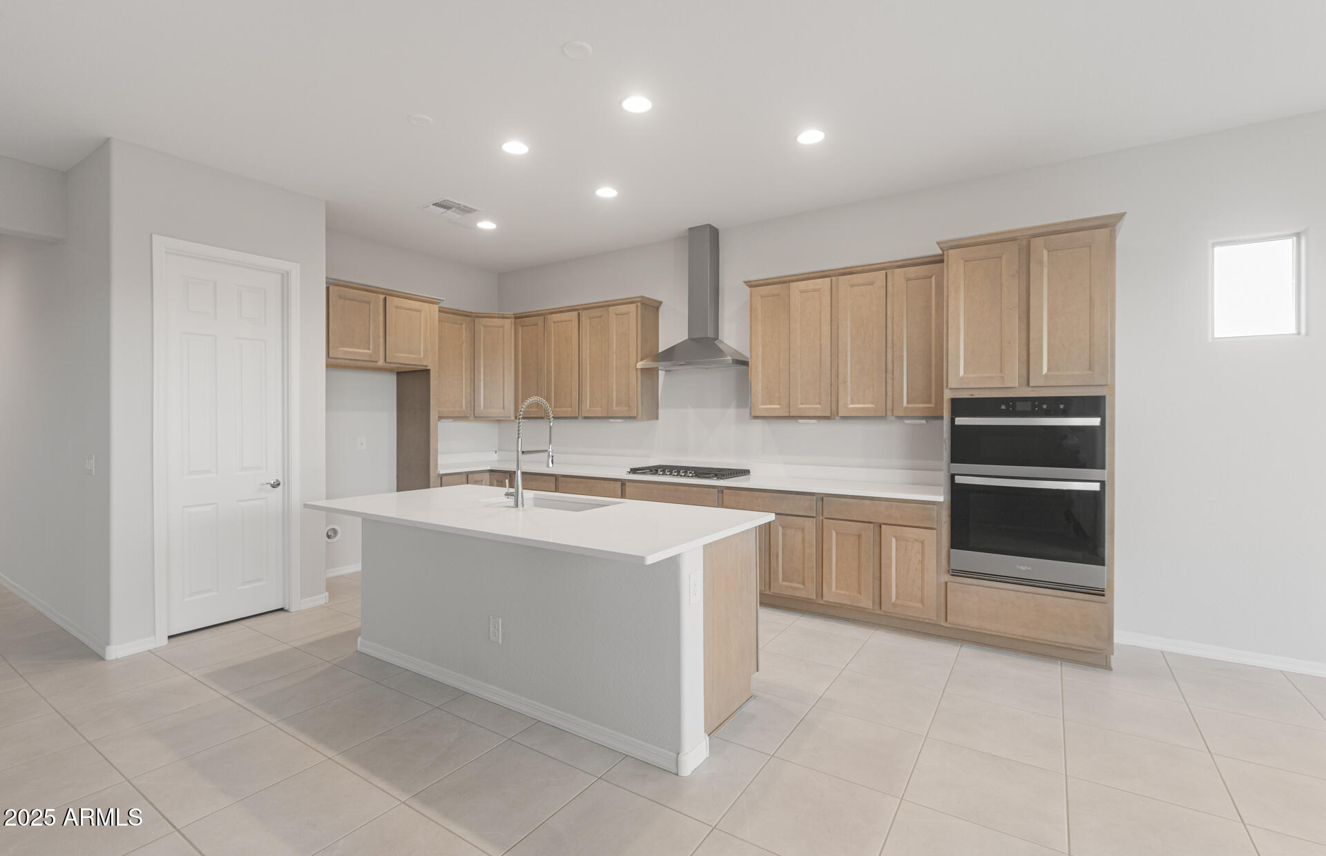16170 West Red Bird Road Surprise, AZ 85387 - Photo 12 of 27 a kitchen with stainless steel appliances granite countertop a refrigerator and a stove top oven