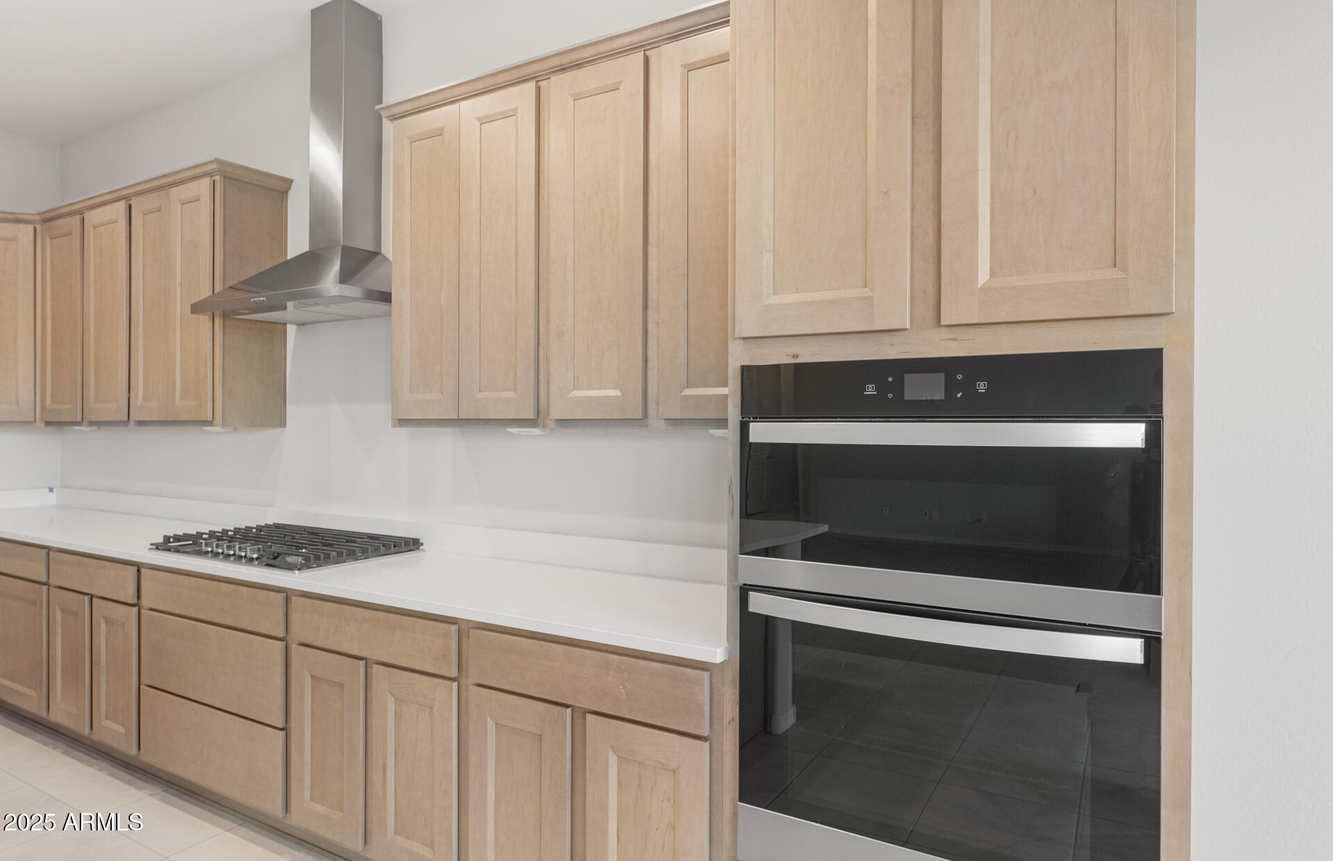 16170 West Red Bird Road Surprise, AZ 85387 - Photo 13 of 27 a kitchen with granite countertop white cabinets and white appliances