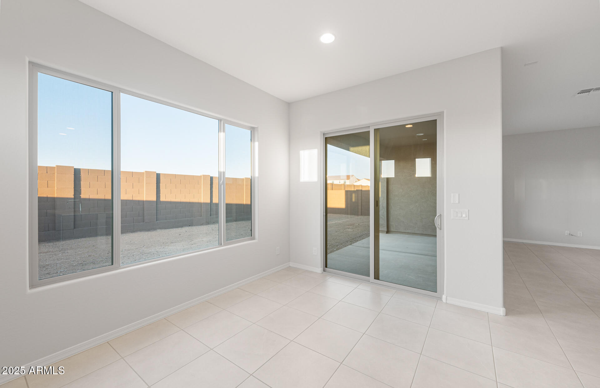 16170 West Red Bird Road Surprise, AZ 85387 - Photo 16 of 27 an empty room with sliding glass door and shower