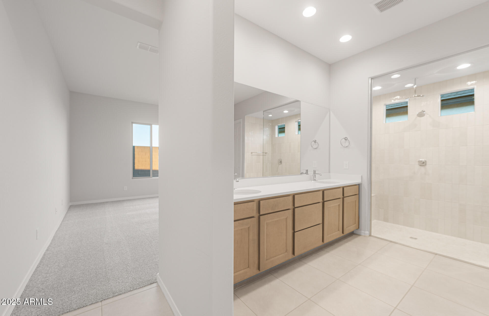 16170 West Red Bird Road Surprise, AZ 85387 - Photo 18 of 27 a spacious bathroom with a mirror and a shower