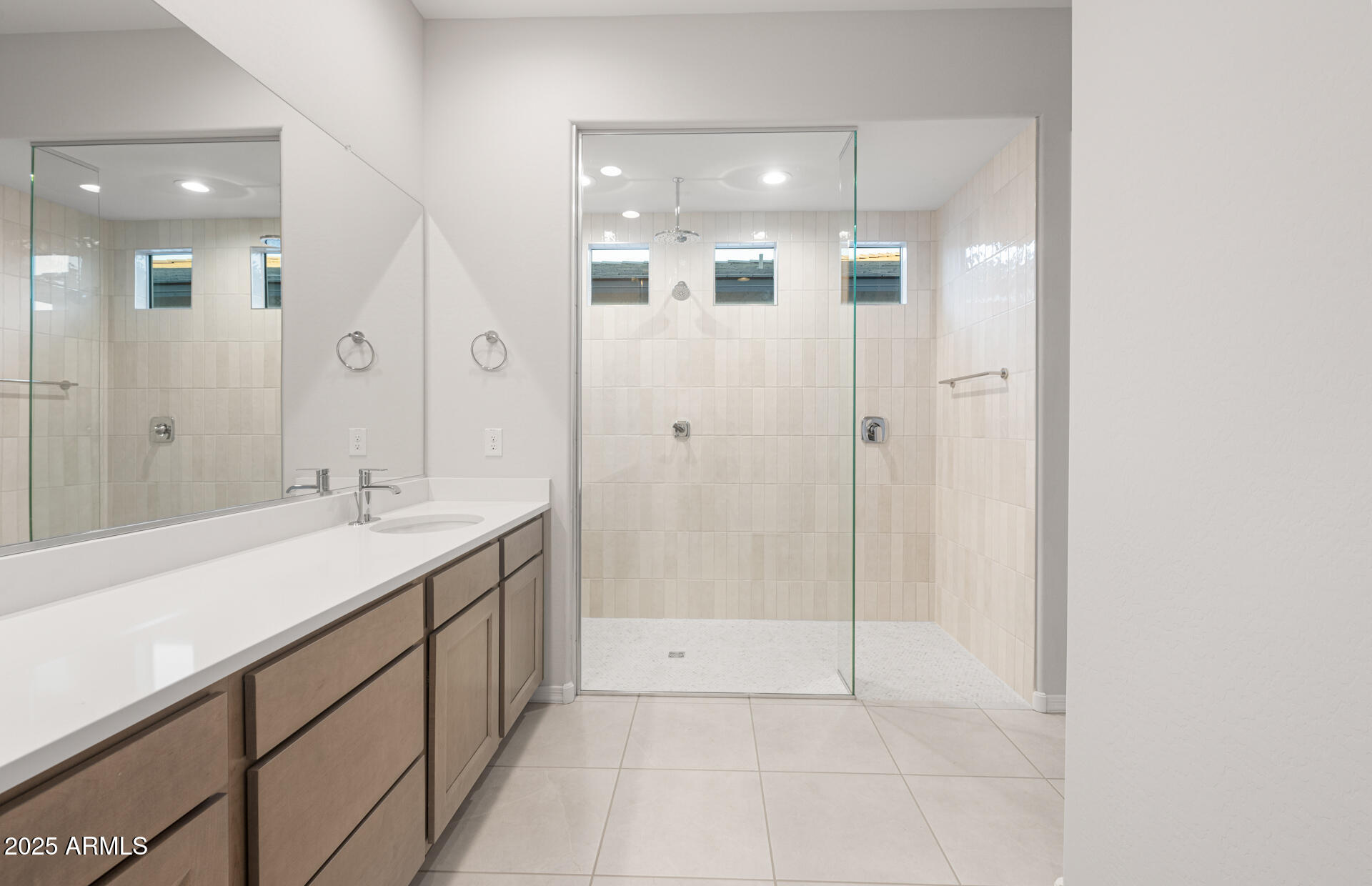 16170 West Red Bird Road Surprise, AZ 85387 - Photo 21 of 27 a bathroom with a shower sink and mirror