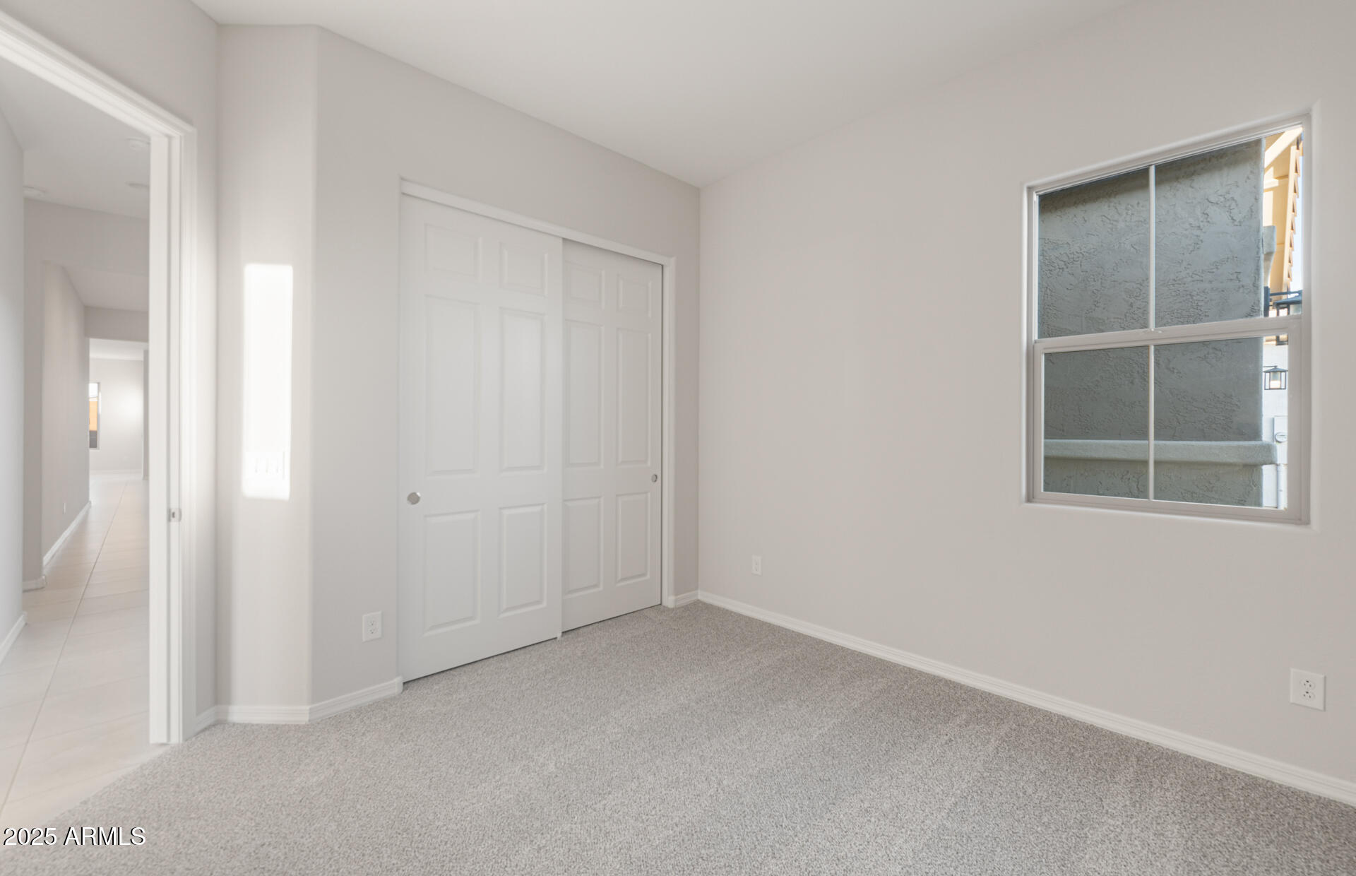 16170 West Red Bird Road Surprise, AZ 85387 - Photo 2 of 27 an empty room with windows