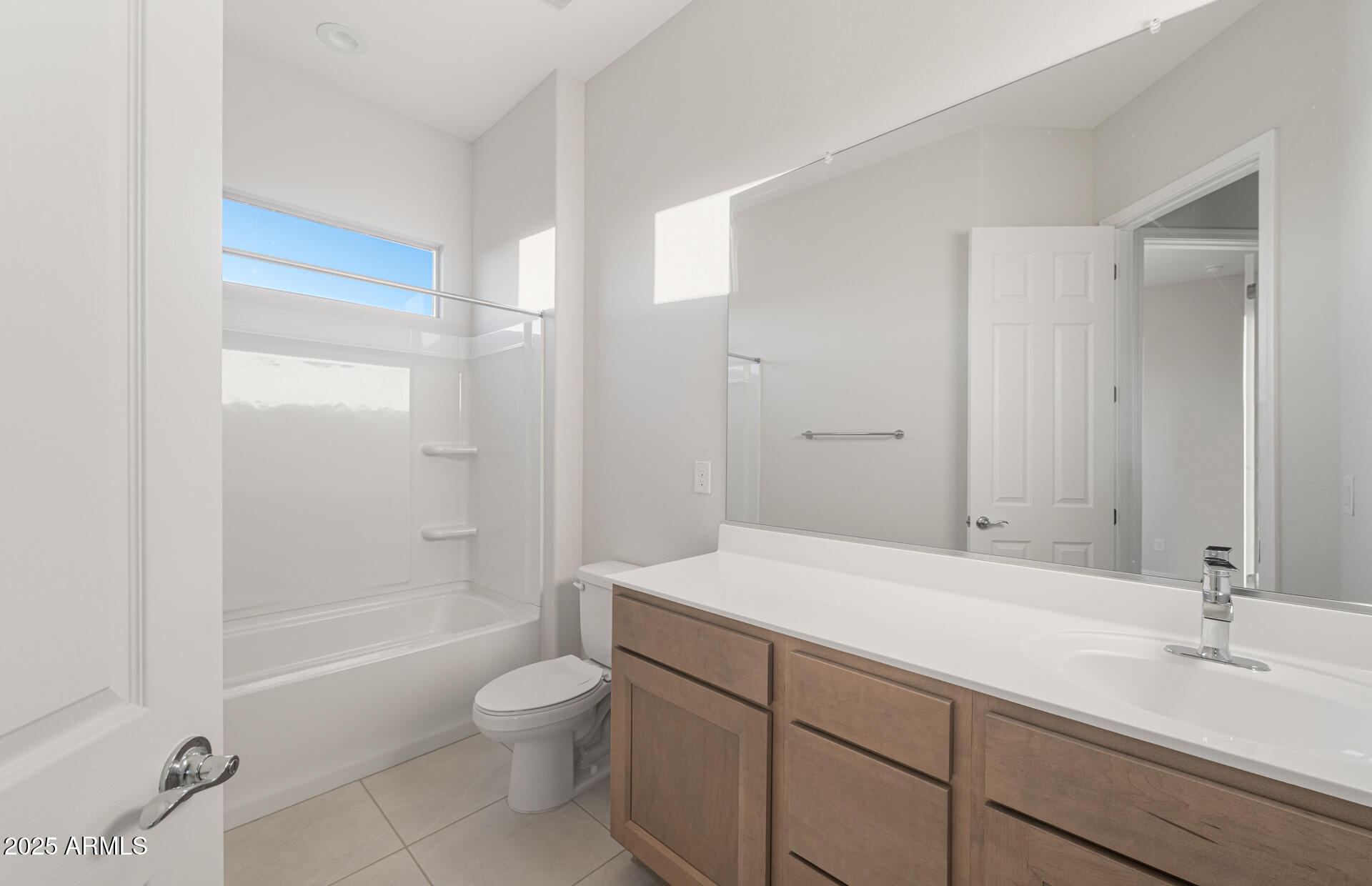 16170 West Red Bird Road Surprise, AZ 85387 - Photo 4 of 27 a bathroom with a granite countertop sink a toilet and shower