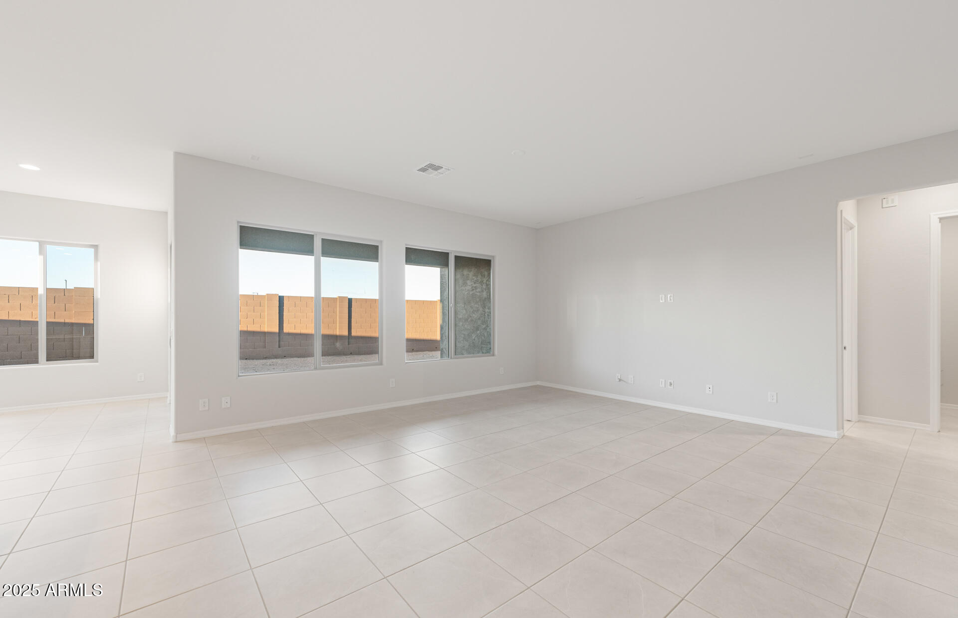 16170 West Red Bird Road Surprise, AZ 85387 - Photo 8 of 27 an empty room with windows