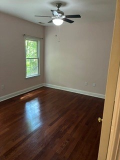 203 Indian Trail Road Seneca, SC 29672 - Photo 7 of 14 Gleaming hardwood floors and a classic window frame highlight this versatile bedroom space.