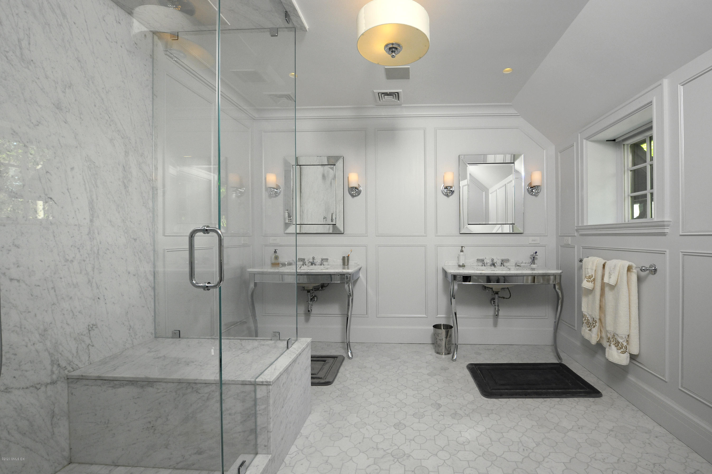 47 Carriglea Drive Riverside, CT 06878 - Photo 16 of 26 a lobby with a chandelier a mirror and a shower