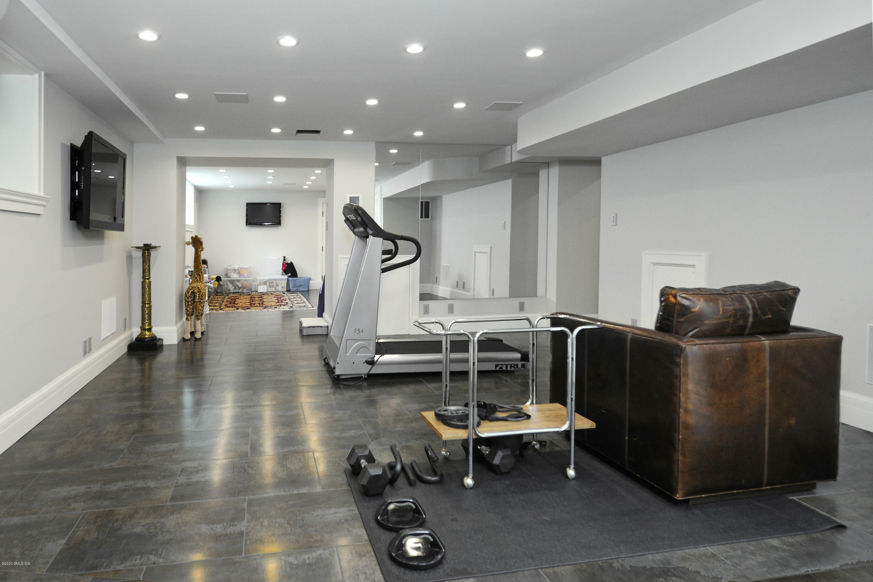 47 Carriglea Drive Riverside, CT 06878 - Photo 21 of 26 a living room with furniture and a flat screen tv