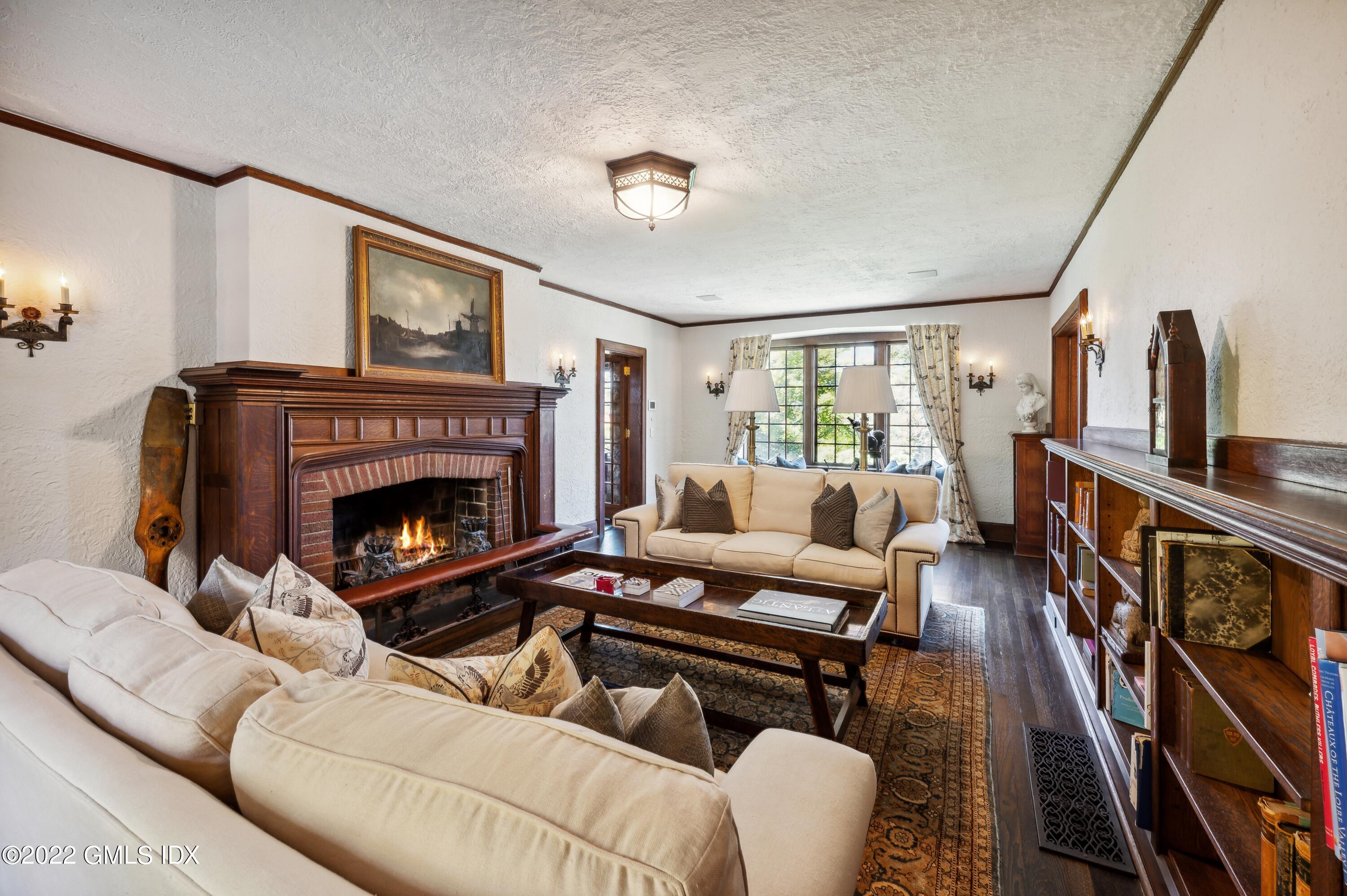 47 Carriglea Drive Riverside, CT 06878 - Photo 5 of 26 a living room with furniture and a fireplace