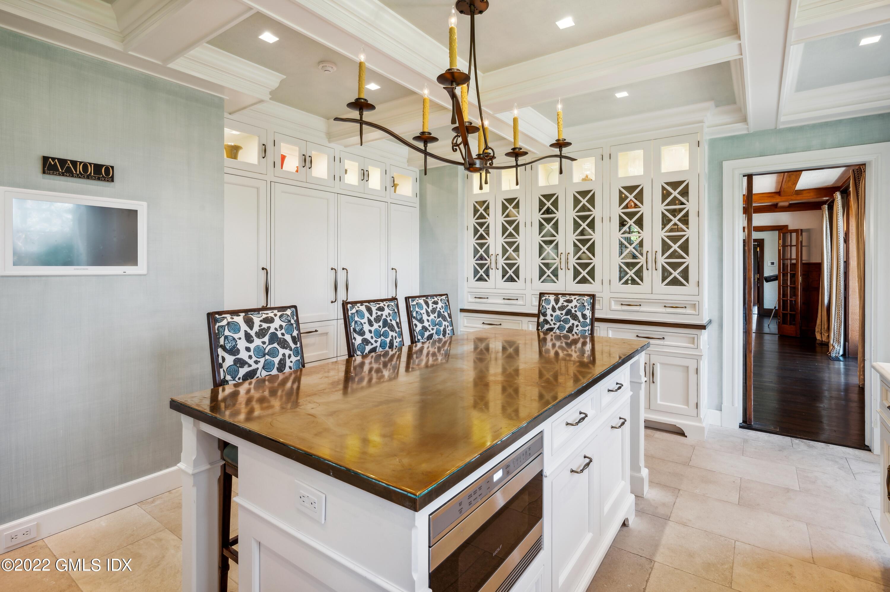 47 Carriglea Drive Riverside, CT 06878 - Photo 8 of 26 a kitchen with stainless steel appliances granite countertop a sink a counter space and cabinets