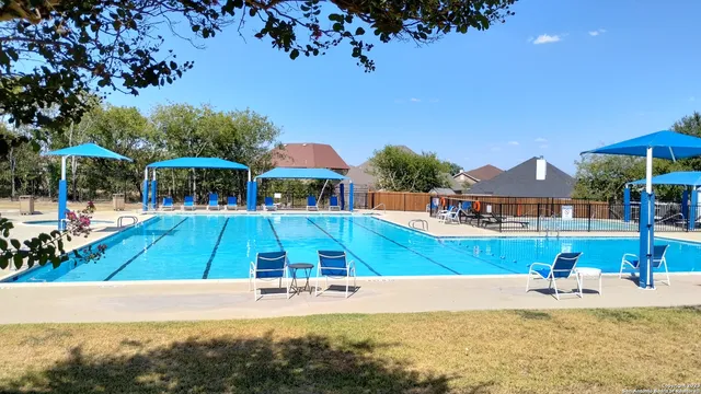 a view of a house with swimming pool