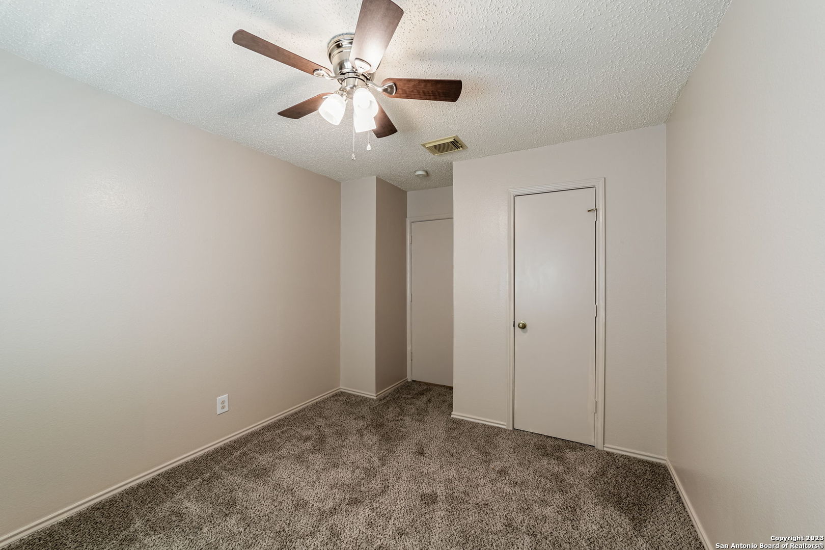 8422 Parry Path Converse, TX 78109 - Photo 13 of 36 an empty room with a ceiling fan and a window