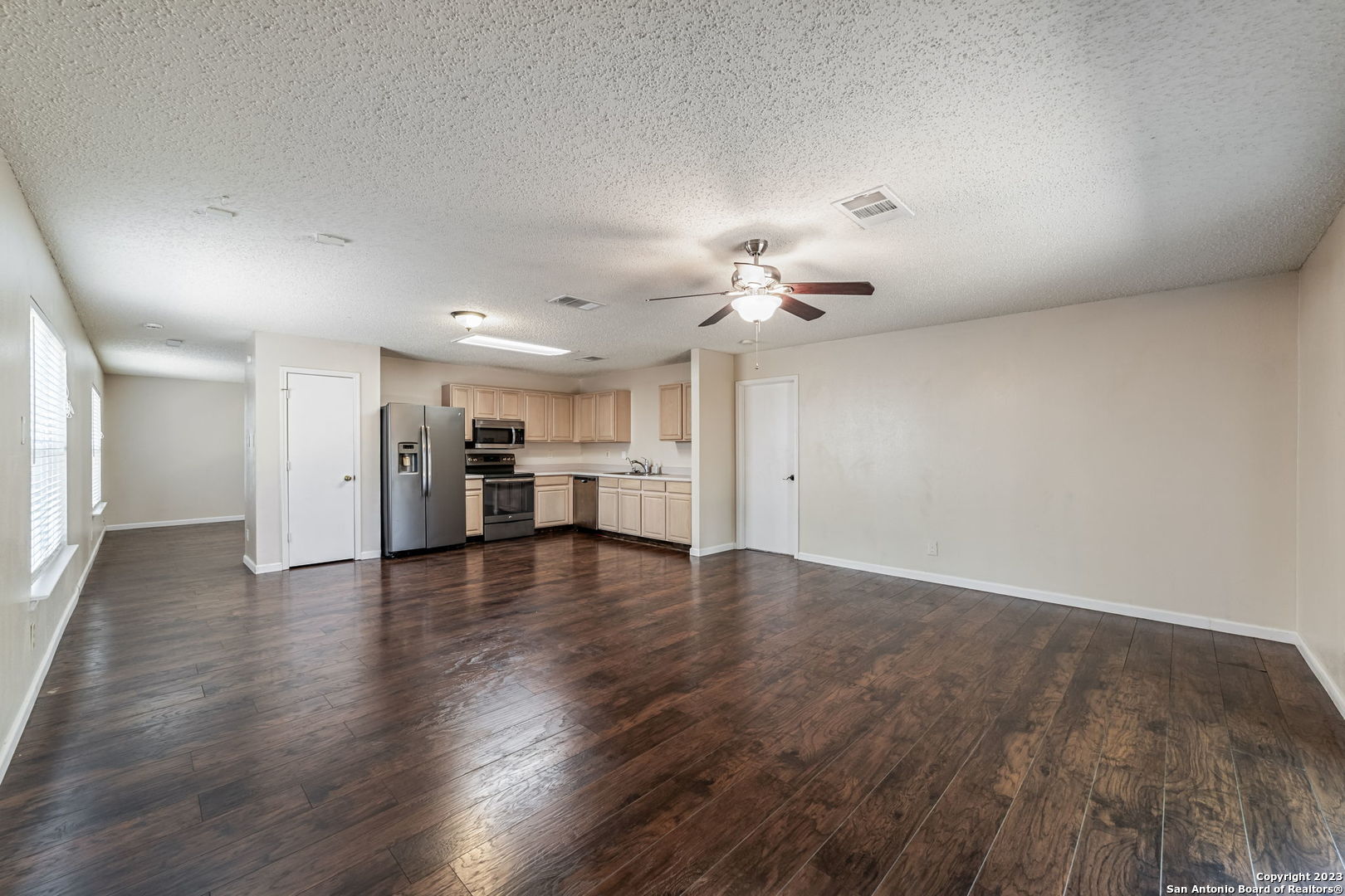 8422 Parry Path Converse, TX 78109 - Photo 19 of 36 a view of empty room with wooden floor