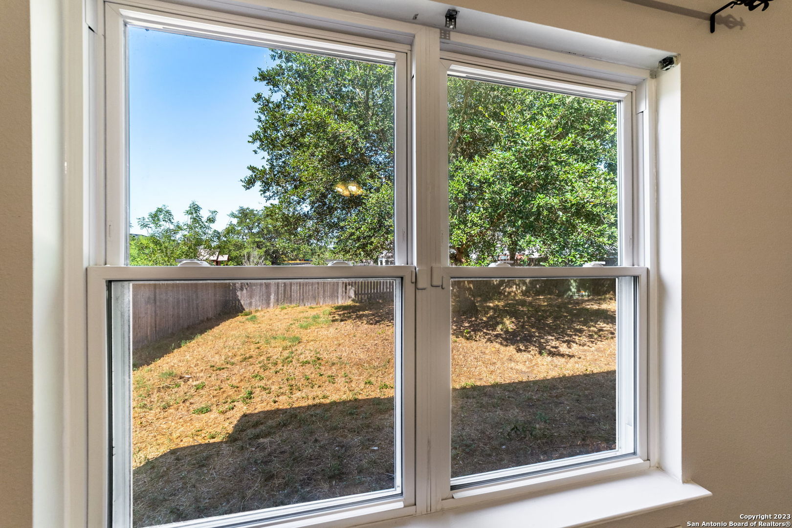 8422 Parry Path Converse, TX 78109 - Photo 25 of 36 a view of a glass door with a yard from a window