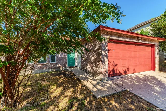 a backyard of a house with large trees
