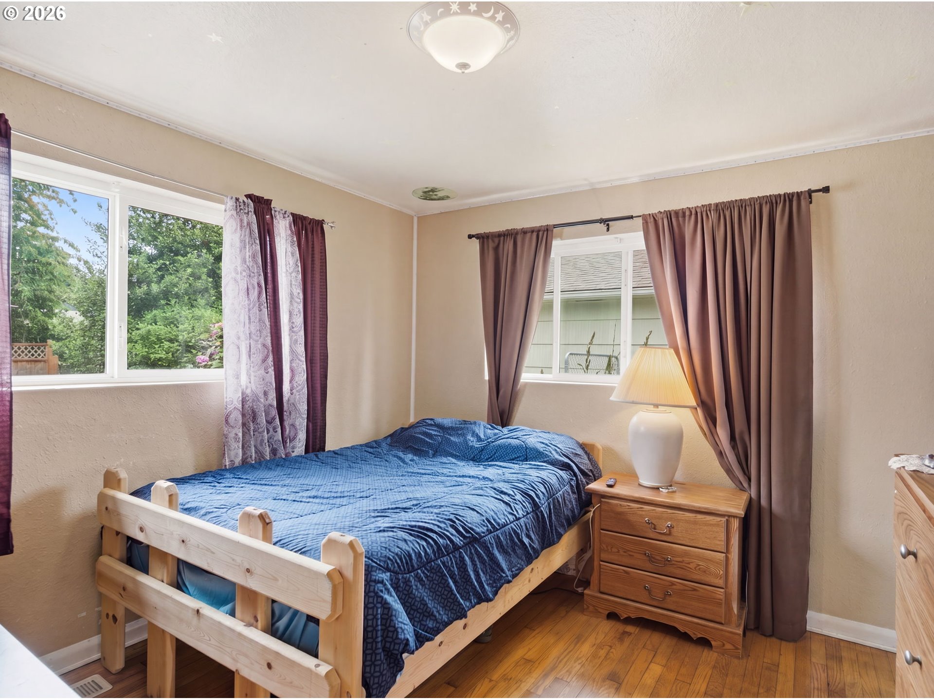 1357 Grove Street Lebanon, OR 97355 - Photo 13 of 37 a bedroom with a bed and a window