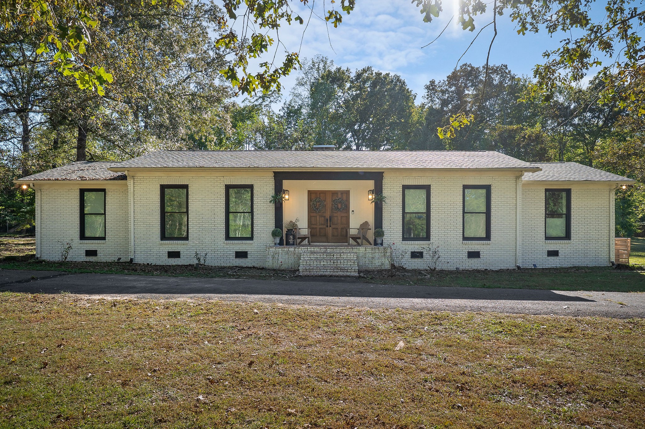 a front view of a house with garden