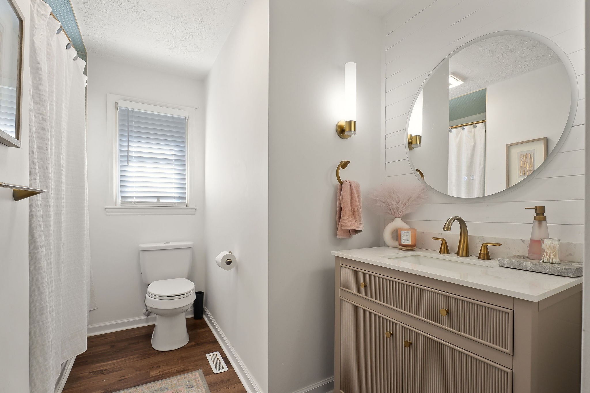 296 Big Rock Road Smithville, TN 37166 - Photo 17 of 32 a bathroom with a toilet sink and mirror
