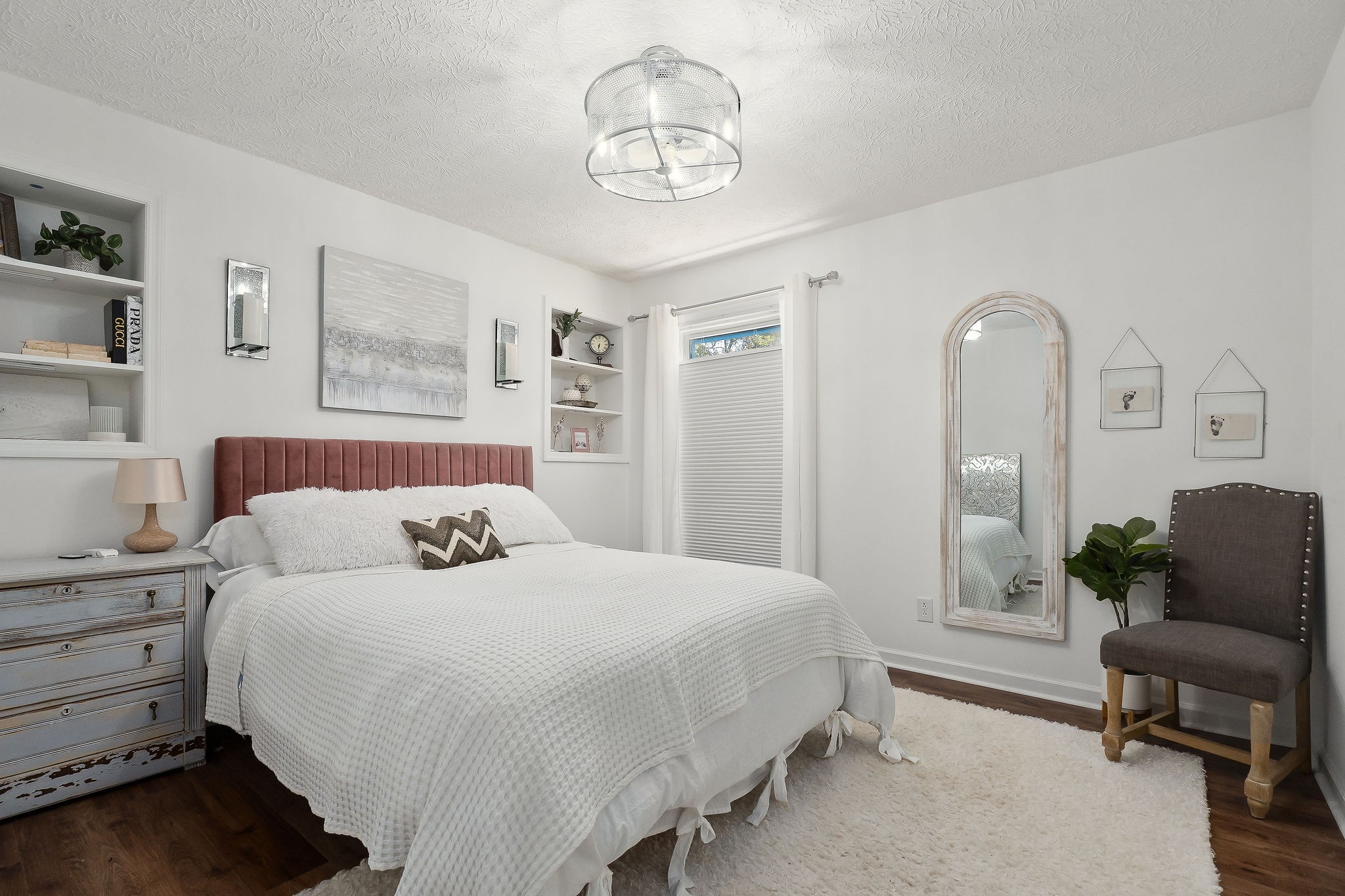 296 Big Rock Road Smithville, TN 37166 - Photo 19 of 32 a spacious bedroom with a bed a couch and dresser