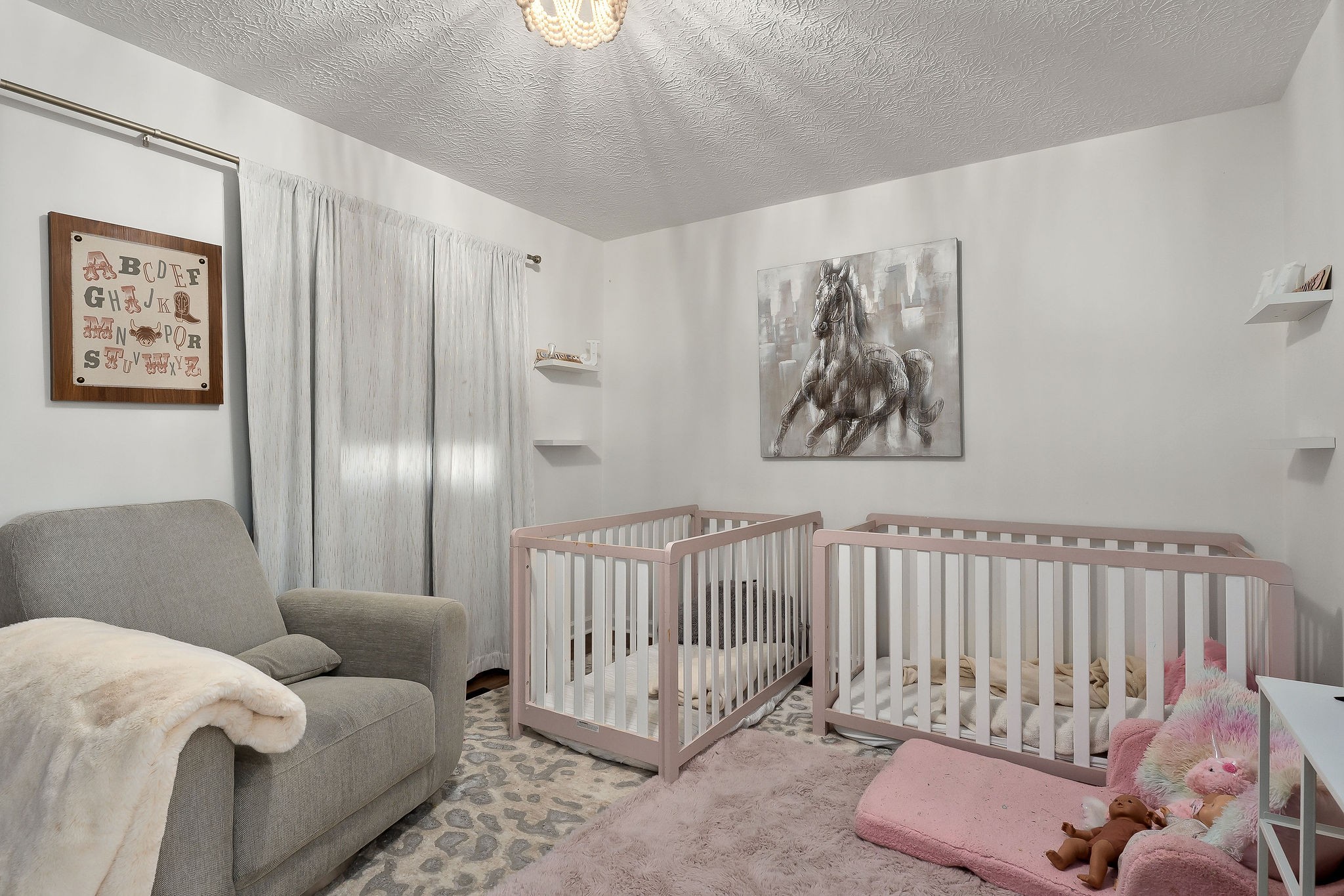 296 Big Rock Road Smithville, TN 37166 - Photo 21 of 32 a living room with furniture and a baby crib